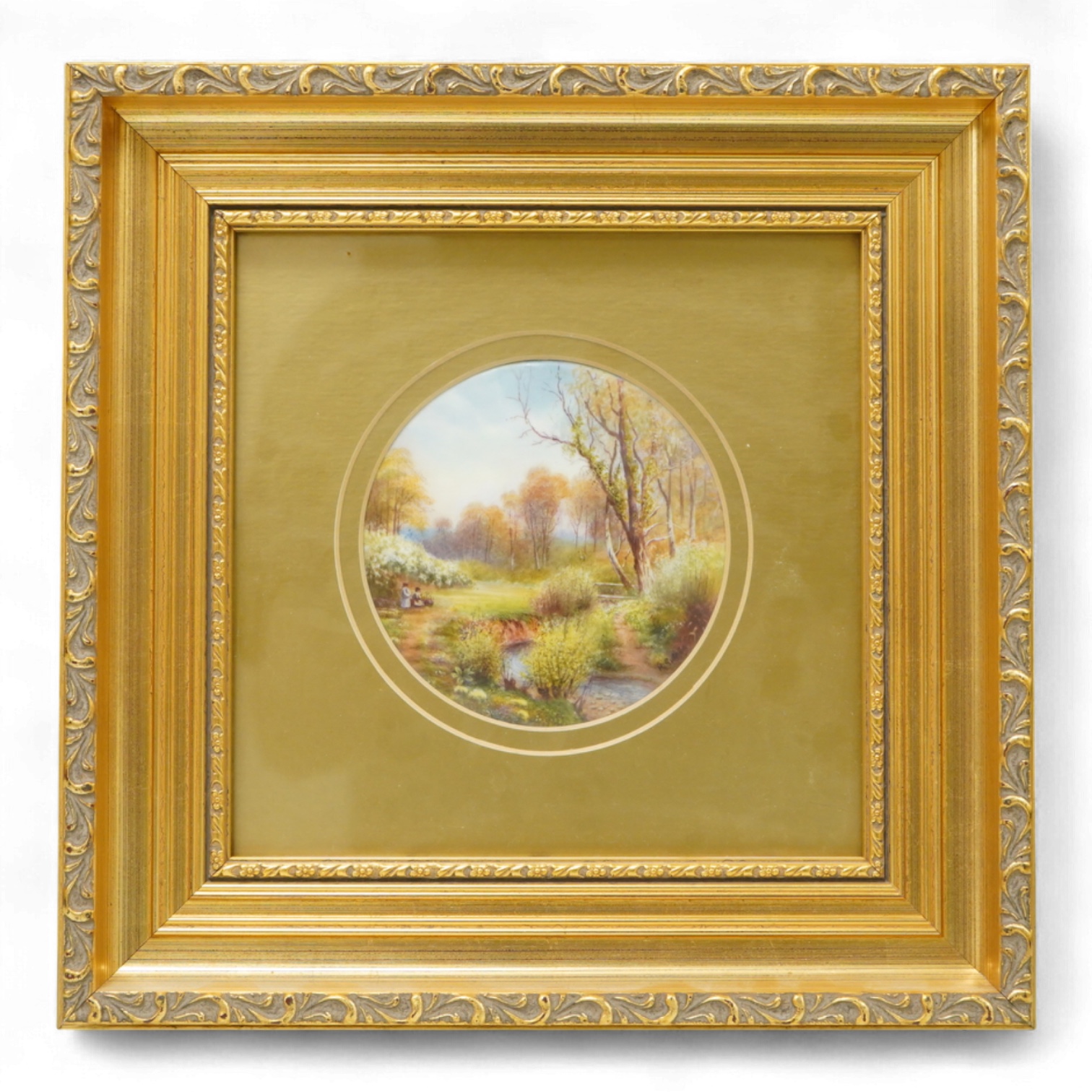 A Royal Worcester circular porcelain plaque depicting a ‘Eckley Woods’ by Raymond Rushton, gilt framed, overall 28cm high